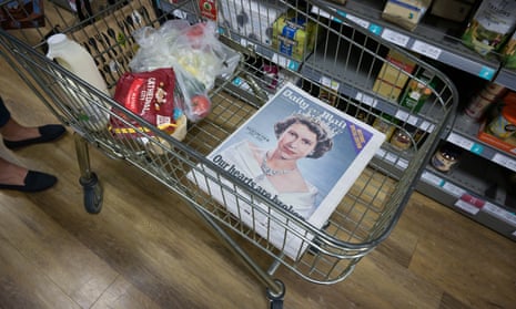 A copy of the Daily Mail, featuring Queen Elizabeth II on the front-page, in a shopping trolley at a Waitrose store in Poundbury