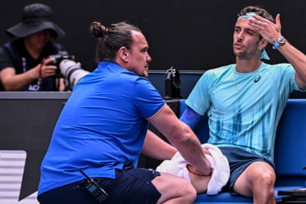 Lorenzo Musetti receives medical treatment.