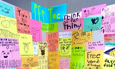 Colorful posters offer advice including 'think of fun things' and 'be positive'