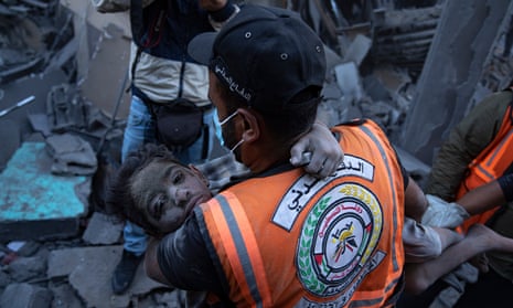 A child is rescued from the rubble in Khan Younis, Gaza Strip.