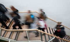 Blurred pupils rushing moving in the hallway corridor of a secondary comprehensive school