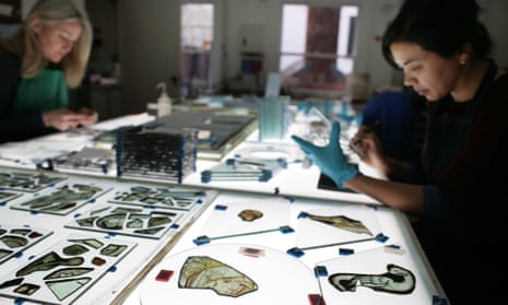 Fragments of glass from Westminster Abbey are inspected by Canterbury Cathedral's glass studio