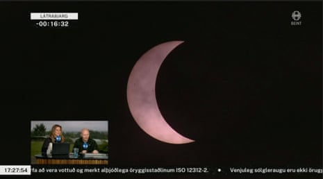 A screengrab from the Icelandic public broadcaster's stream of the solar eclipse 2026 showing the scene in Látrabjarg, Iceland
