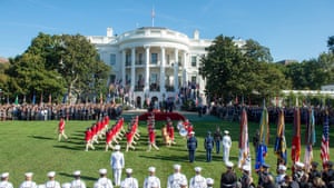 Donald and Melania Trump welcome Scott and Jenny Morrison on the south lawn with full military honours.