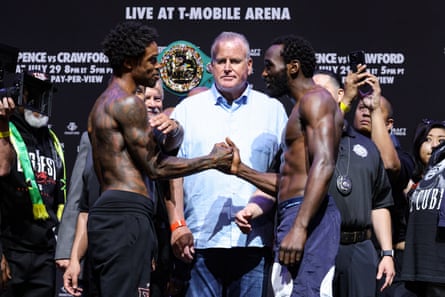 Spence vs. Crawford: An Epic Showdown between Silent American Warriors in the Boxing Ring 1 Errol Spence, left, and Terence Crawford shake hands during the traditional staredown after Friday’s weigh-in ahead of their forthcoming welterweight title unification fight.