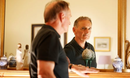 Pat Nevin looking in a mirror at home
