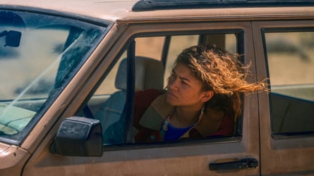Zendaya arsenic Rue successful Euphoria play three, sitting successful a car pinch her caput retired of nan window