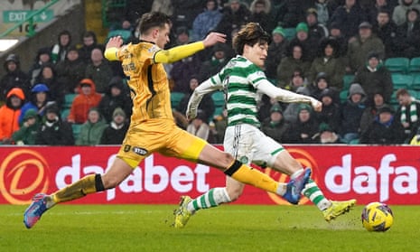 Kyogo Furuhashi (right) scores Celtic’s third goal in their 3-0 victory over Livingston.