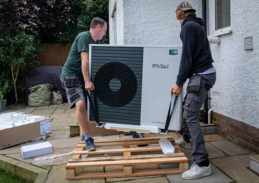 An air source heat pump unit being installed in a house in Folkestone
