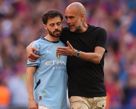 Pep Guardiola comforts a dejected Bernardo Silva after the FA Cup final between Crystal Palace and Manchester City.
