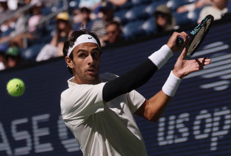 Italy's Lorenzo Musetti plays a backhand shot