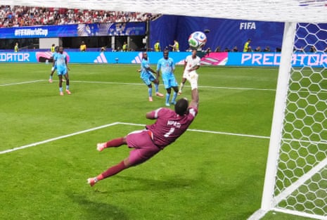 Lionel Mpasi punches the ball away