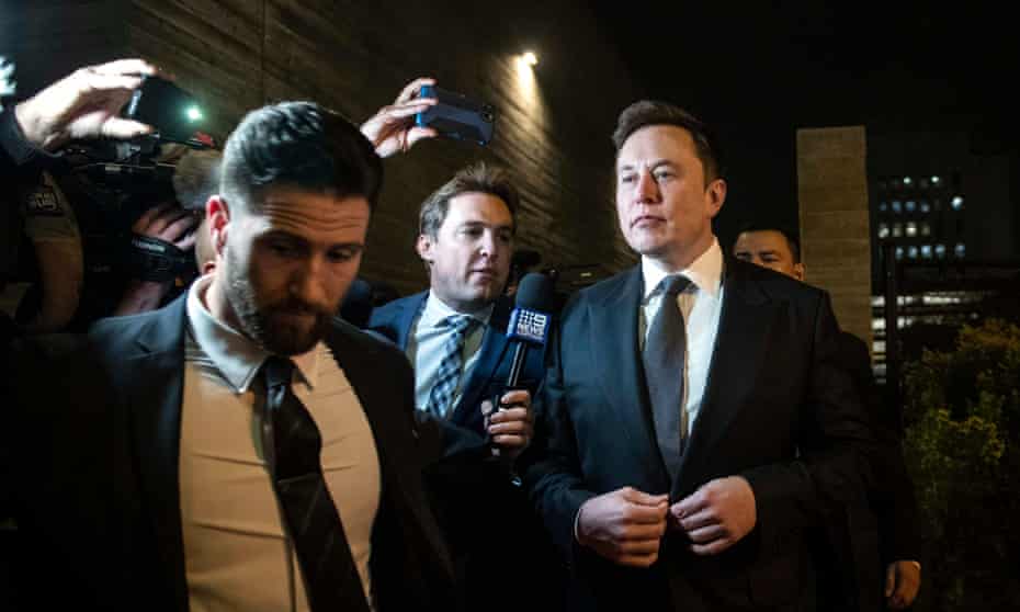  Elon Musk leaves after the first day of the trial in Los Angeles.