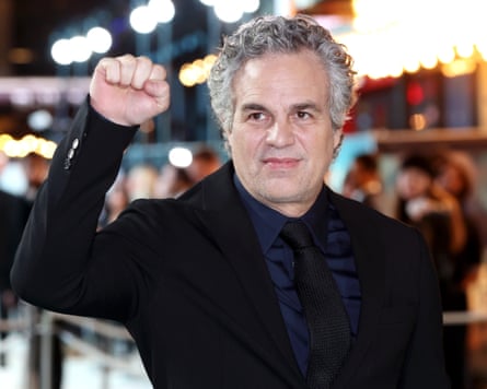 Mark Ruffalo holds up a fist at a film premiere in January