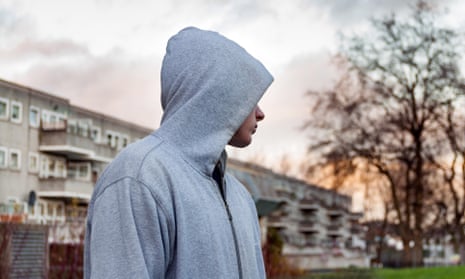 Teenager hanging around dressed in hoodie clothing