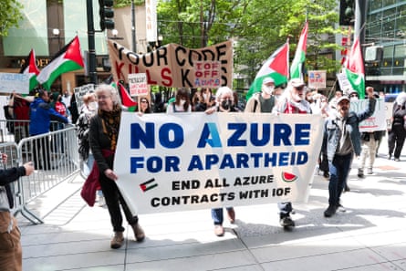 people hold a banner that reads ‘no Azure for apartheid end all Azure contracts with IOF’