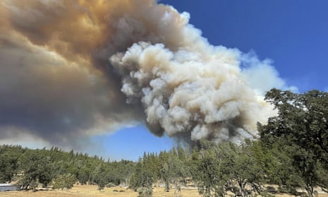 A large plume from the River Fire fills the air with smoke in Colfax, California.