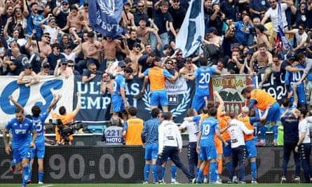 Empoli players and fans celebrate after M’baye Niang’s late goal.