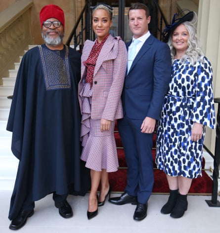 Cush Jumbo in October 2019, with parents Marx and Angela, and husband Sean Griffin, receiving an OBE for her services to drama