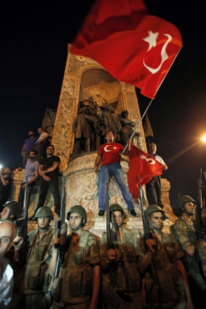 Turkish soldiers secure the area as supporters of Turkey’s President Recep Tayyip Erdogan protest in Istanbul’s Taksim Square.