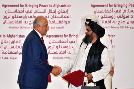 2020: US Special Representative for Afghanistan Reconciliation Zalmay Khalilzad and Taliban co-founder Mullah Abdul Ghani Baradar shake hands after signing a peace agreement during a ceremony in the Qatari capital Doha.