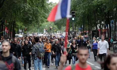 Demonstrators march in central Paris in protest against the imposition of Covid tests for people who want to eat in restaurants or take long-distance trips.