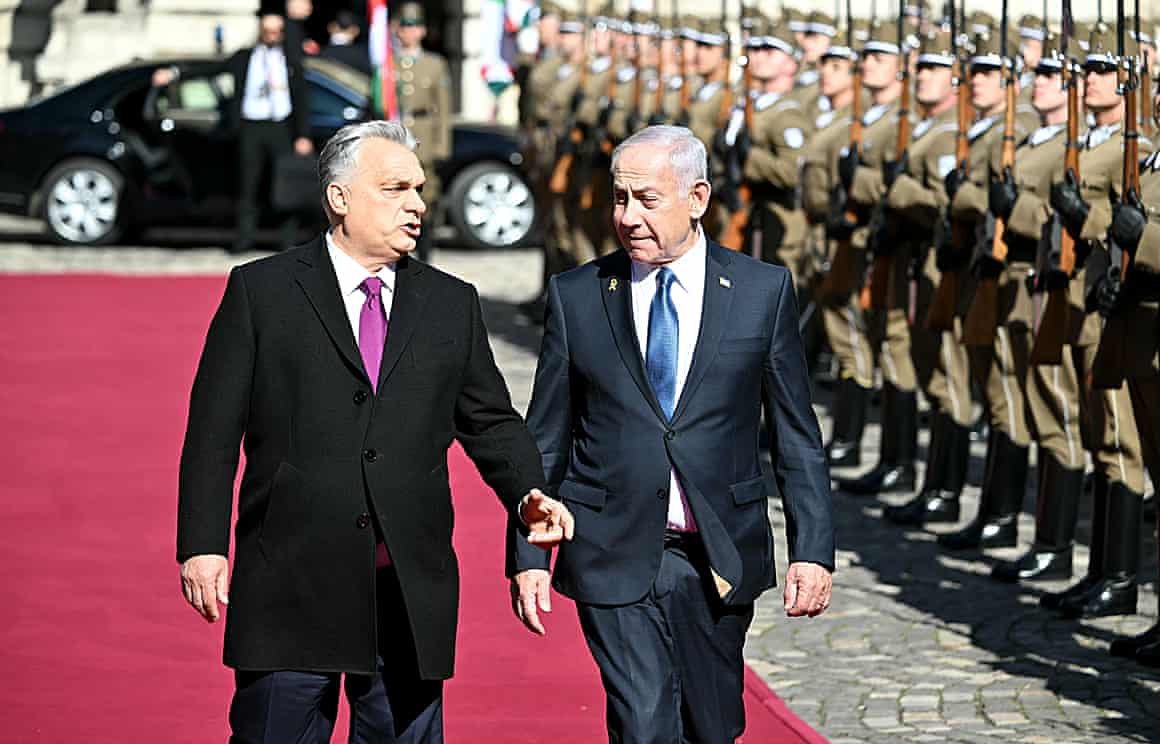Hungary’s prime minister, Viktor Orban (left), and the Israeli prime minister, Benjamin Netanyahu, review a military honour guard in Budapest