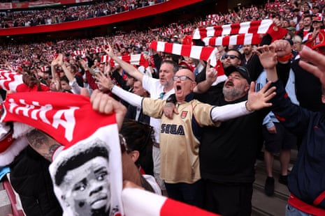 Arsenal fans show their support prior to the Premier League match against Fulham.
