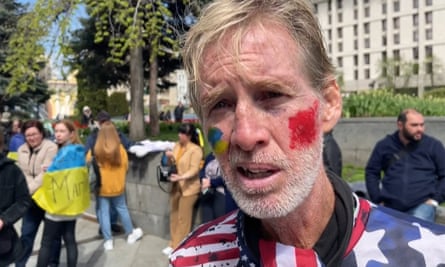 a man with flags painted on his face