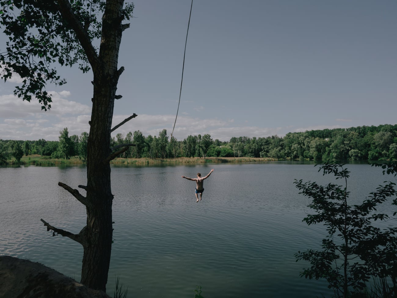 A lake between Irpin and Bucha is a favorite swimming spot for young people in Kyiv