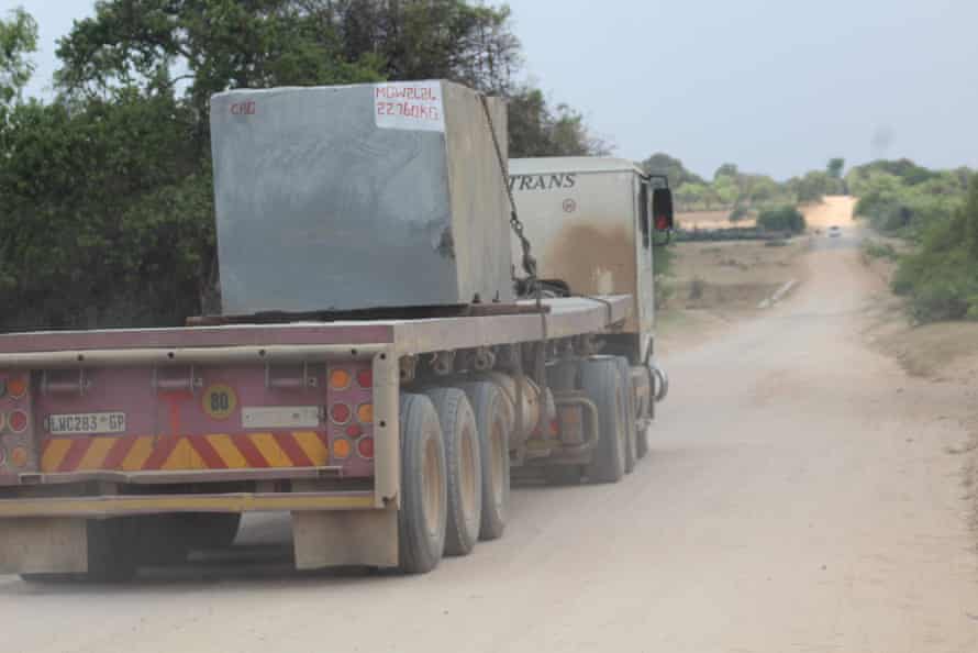 A truck transporting black granite.