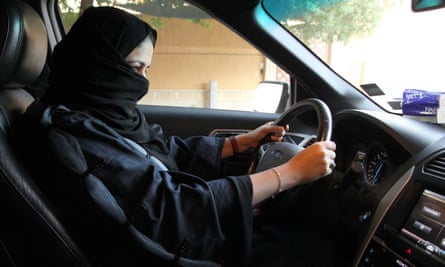 A woman sits behind the wheel of a car in Riyadh last month.