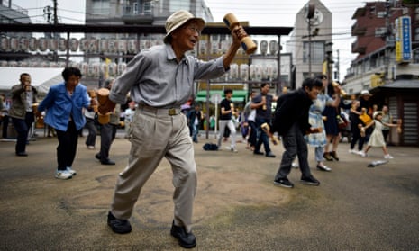 People exercise during an event marking Respect for the Aged Day in Tokyo, Japan.