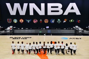 After the WNBA announcement of the postponed games for the evening, the Washington Mystics each wear white T-shirts with seven bullets on the back protesting the shooting of Jacob Blake by Kenosha, Wisconsin police at Feld Entertainment Center on August 26, 2020 in Palmetto, Florida.