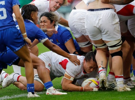 Maddie Feaunati of England, whose father played for Samoa, scores a try.