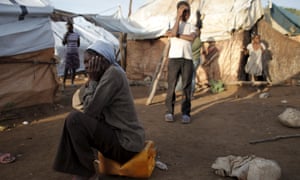 Lamesi Jean (left) at a refugee camp for Haitians returning from the Dominican Republic on the outskirts of Anse-a-Pitres, Haiti