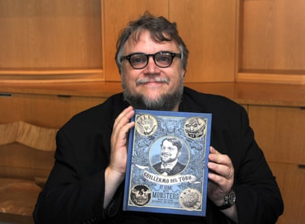 Del Toro with the catalogue for his show.