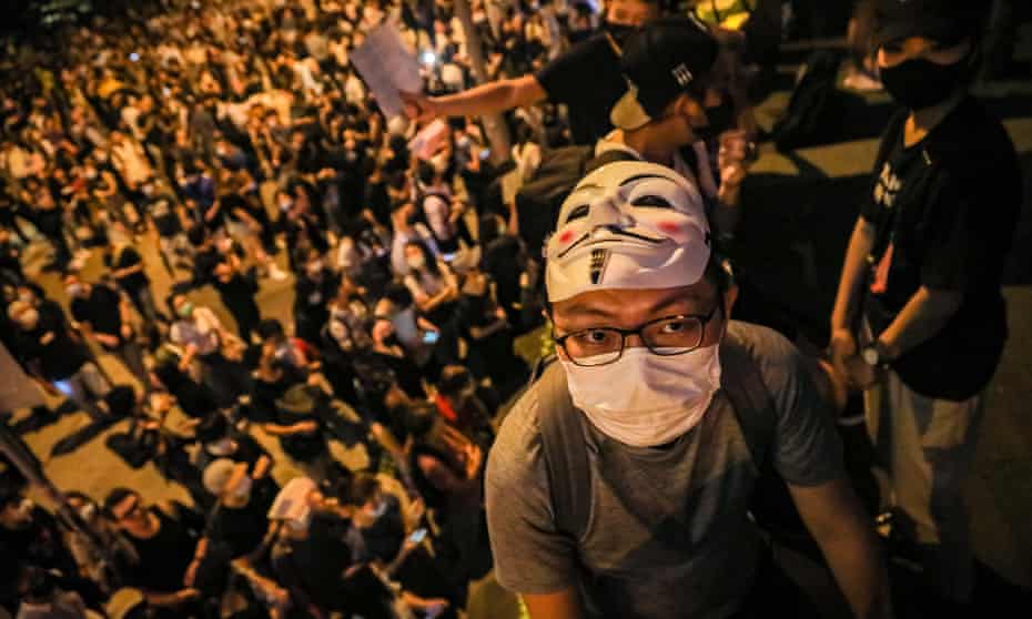 A man wearing a mask attends a protest Chater Garden in Hong Kong. Critics say Apple removed the HKmap app used by protesters after pressure from Beijing. 