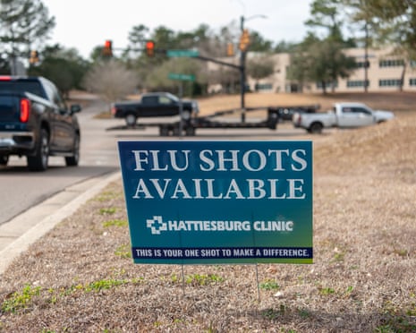 A sign encouraging flu vaccines remains outside the Hattiesburg Clinic in Hattiesburg, Miss. on Feb. 10, 2026. Rory Doyle for The Guardian
