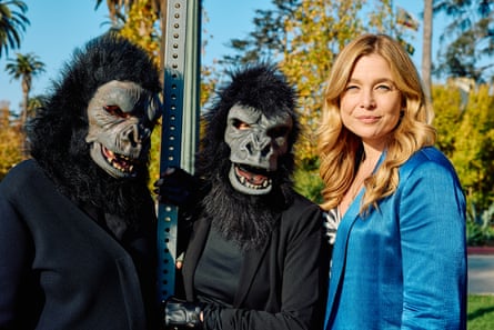 Kate Bryan with Frida Kahlo and Käthe Kollwitz, who are wearing gorilla costumes.