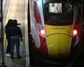 Police officers work on the platform at Huntingdon station following a mass stabbing on the train on 1 November.