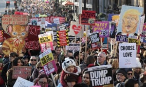 Protesters make their way through the streets of London during the Women's March on 21 January 2017