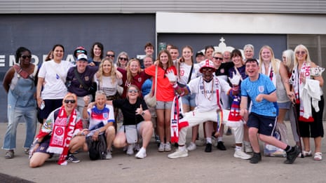 England fans pose outside of the stadium before the match between Spain and England