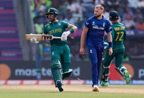 Hendricks runs as Atkinson looks on.