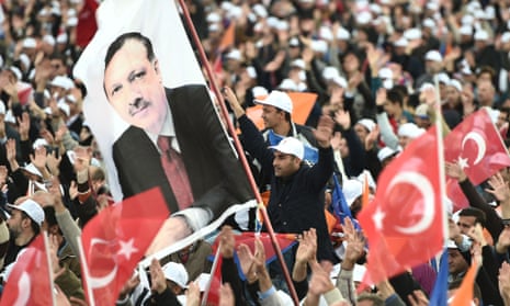 Supporters wave a flag at an AKP election rally.