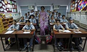 Teacher Archana Shori and seventh grade students at Rukmini Devi public school