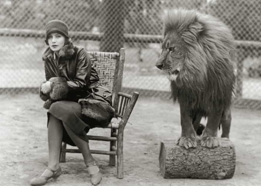 Greta Garbo and Leo the lion, mascot for film company MGM, circa 1926
