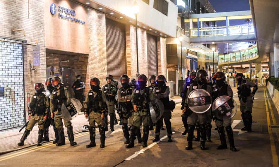 Police stand guard near Hong Kong Polytechnic in November 2019
