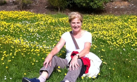 Danielle Carr-Gomm sitting among grass and yellow flowers eiqekidqxihkinv