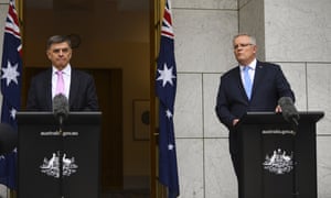 Australia’s Chief Medical Officer Brendan Murphy (L) and prime minister, Scott Morrison, hold a press conference at Parliament House in Canberra.